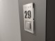 door number with a hole for the bell