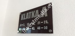 Cage name and apartment numbers board