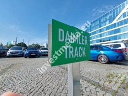 parking signs on a post mounted to concrete, stone, paving stones manufacturer