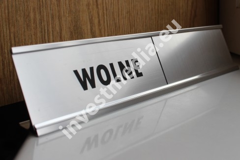 Slip-out plate engraved on the desk
