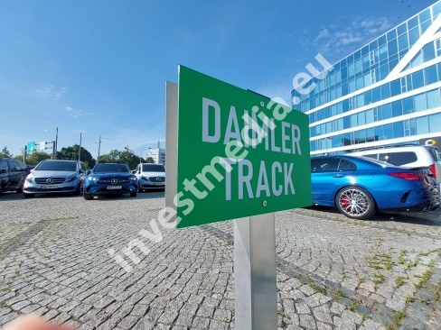 parking signs on a post mounted to concrete, stone, paving stones manufacturer