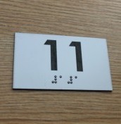 signs with numbers and braille balls