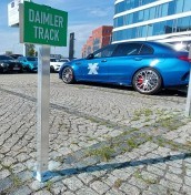 parking signs on a post mounted to concrete, stone, paving stones manufacturer