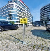 parking signs on a post mounted to concrete, stone, paving stones manufacturer