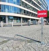 parking signs on a post mounted to concrete, stone, paving stones manufacturer