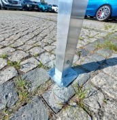 parking signs on a post mounted to concrete, stone, paving stones manufacturer