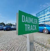 parking signs on a post mounted to concrete, stone, paving stones manufacturer