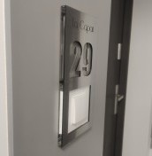 door number with a hole for the bell
